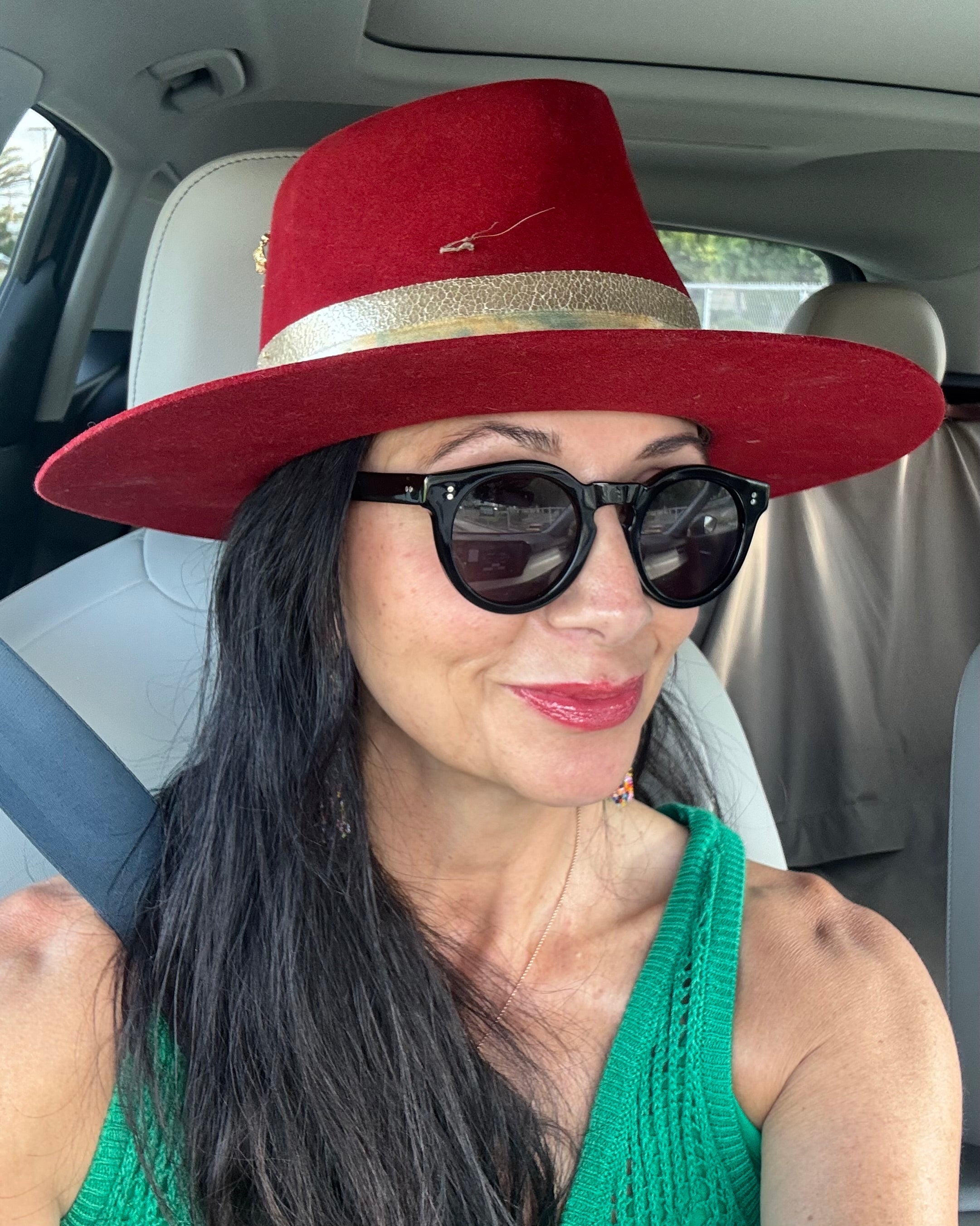 Woman over 50 with naturally radiant skin reflecting healthy aging from within. Karina smiling outdoors, embracing healthy aging with confidence and natural beauty. Thoughtful skincare ritual supporting healthy aging after 50.